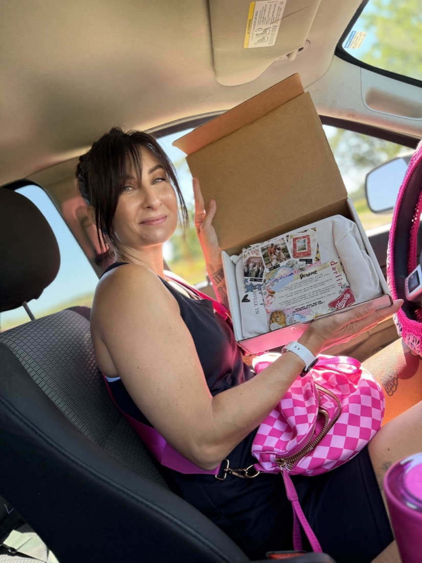 Customer holding a newly arrived Canvas Bible in its shipping box