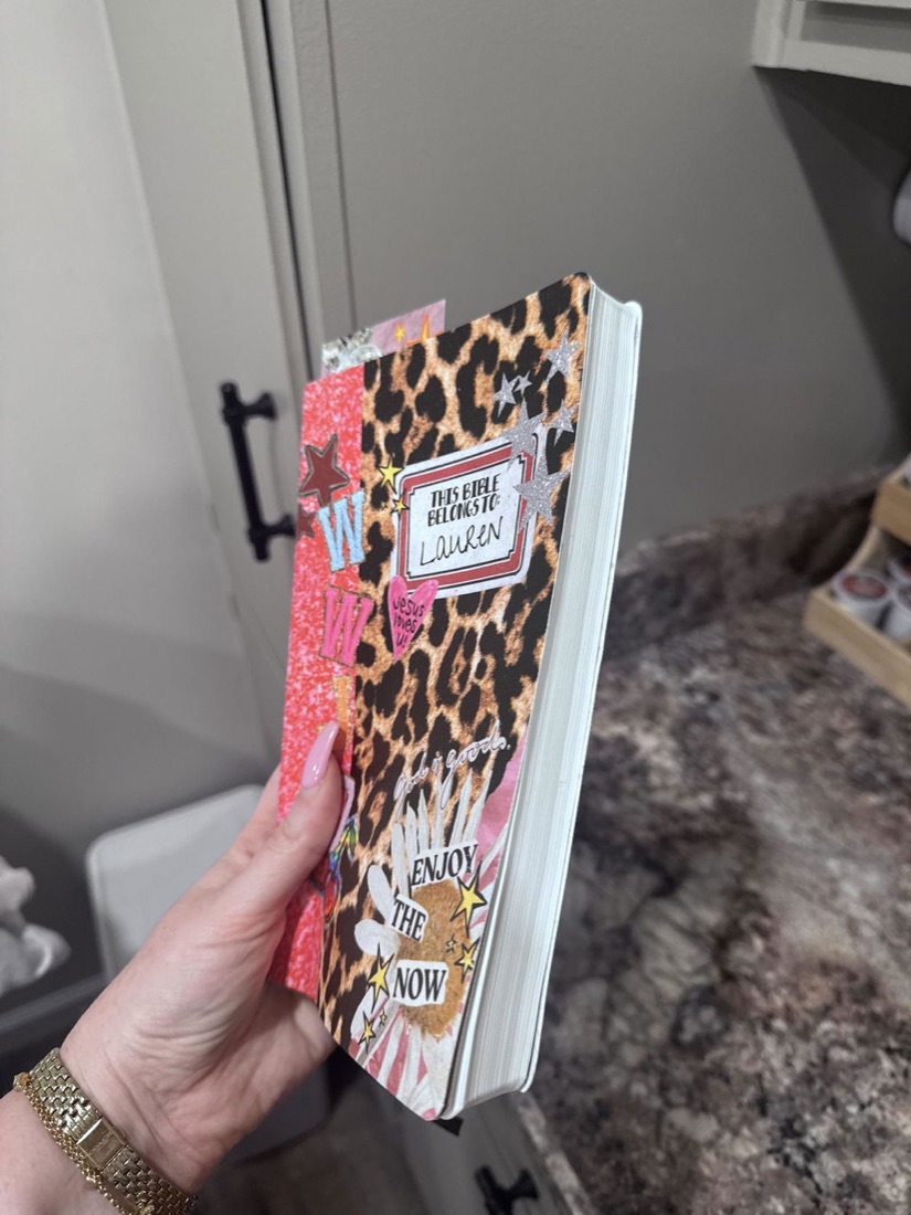 Personalized Canvas Bible held by a customer at home